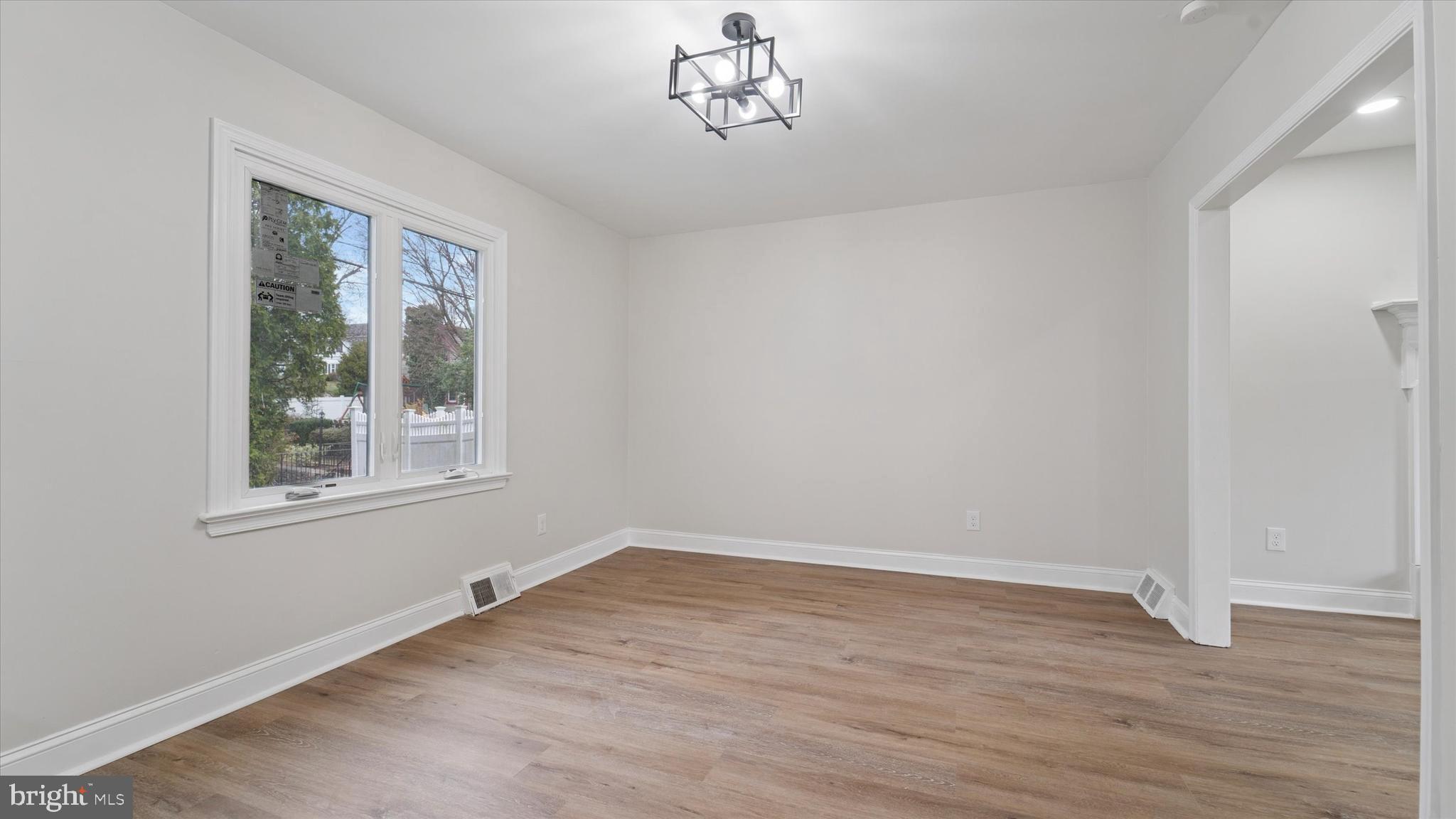 21 Fairview Road Springfield, PA 19064 - Photo 8 of 25 a view of empty room with wooden floor and fan