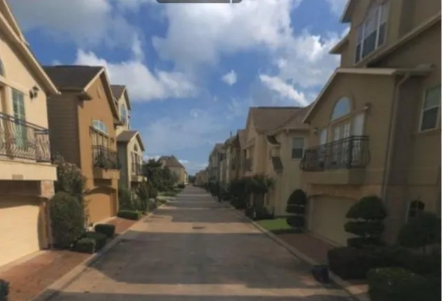 a city street lined with tall buildings
