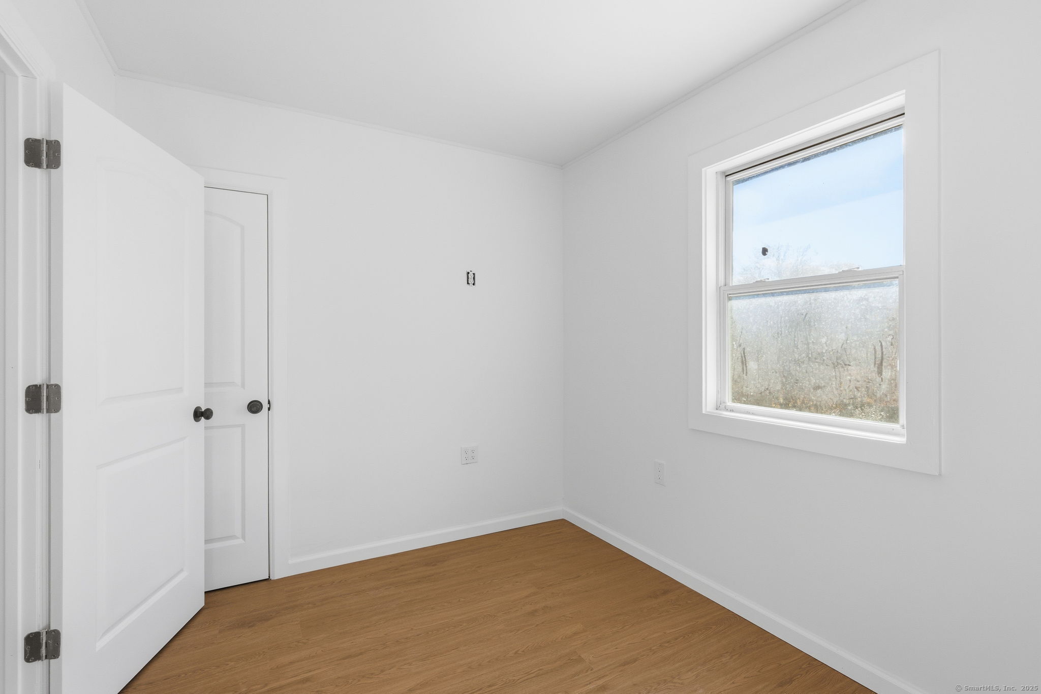 18 Pautipaug Hill Road Baltic, CT 06330 - Photo 32 of 35 an empty room with windows and closet