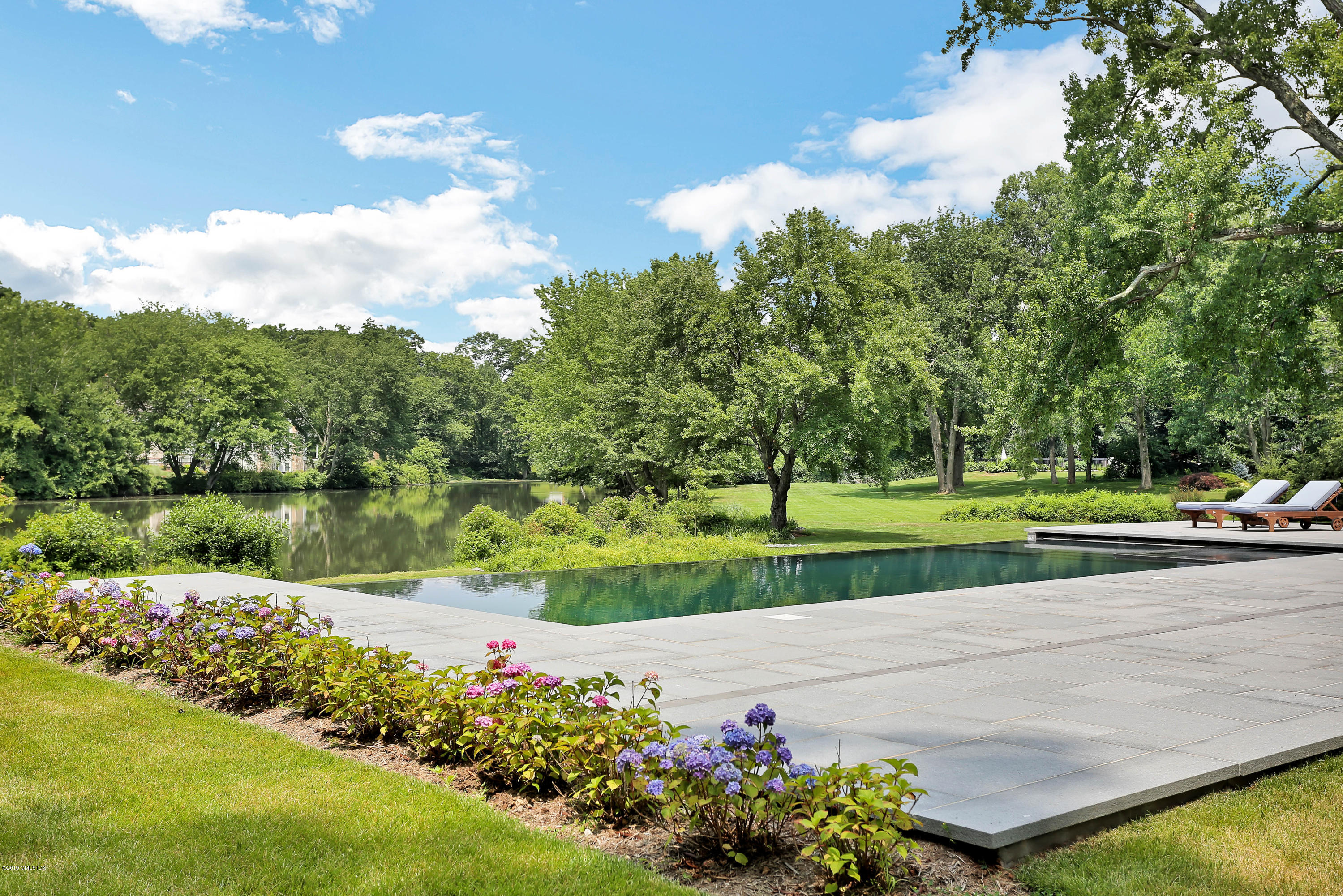 38 Birch Lane Greenwich, CT 06830 - Photo 12 of 31 a view of a garden with houses