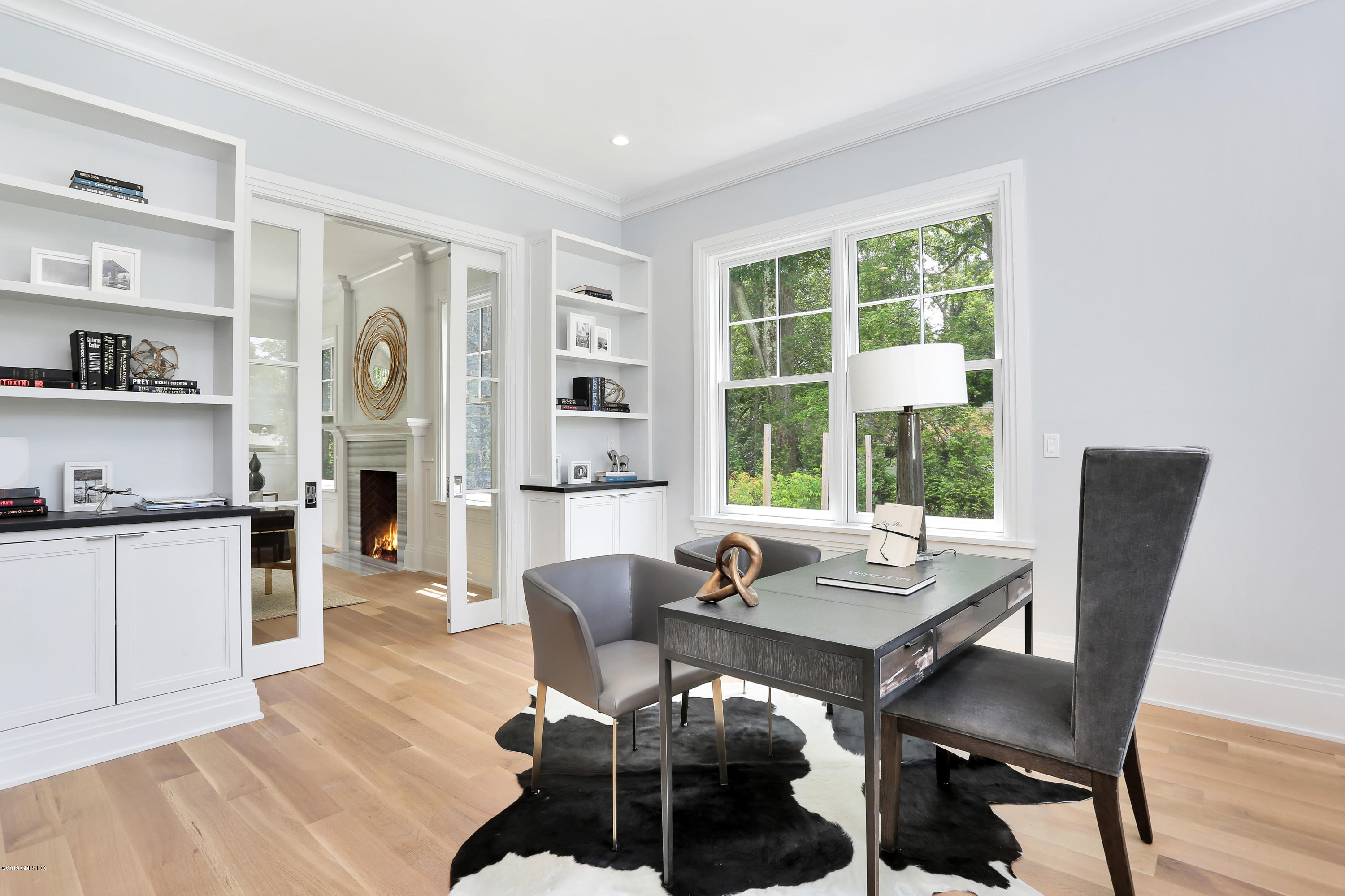 38 Birch Lane Greenwich, CT 06830 - Photo 14 of 31 a view of a dining room with furniture window and wooden floor