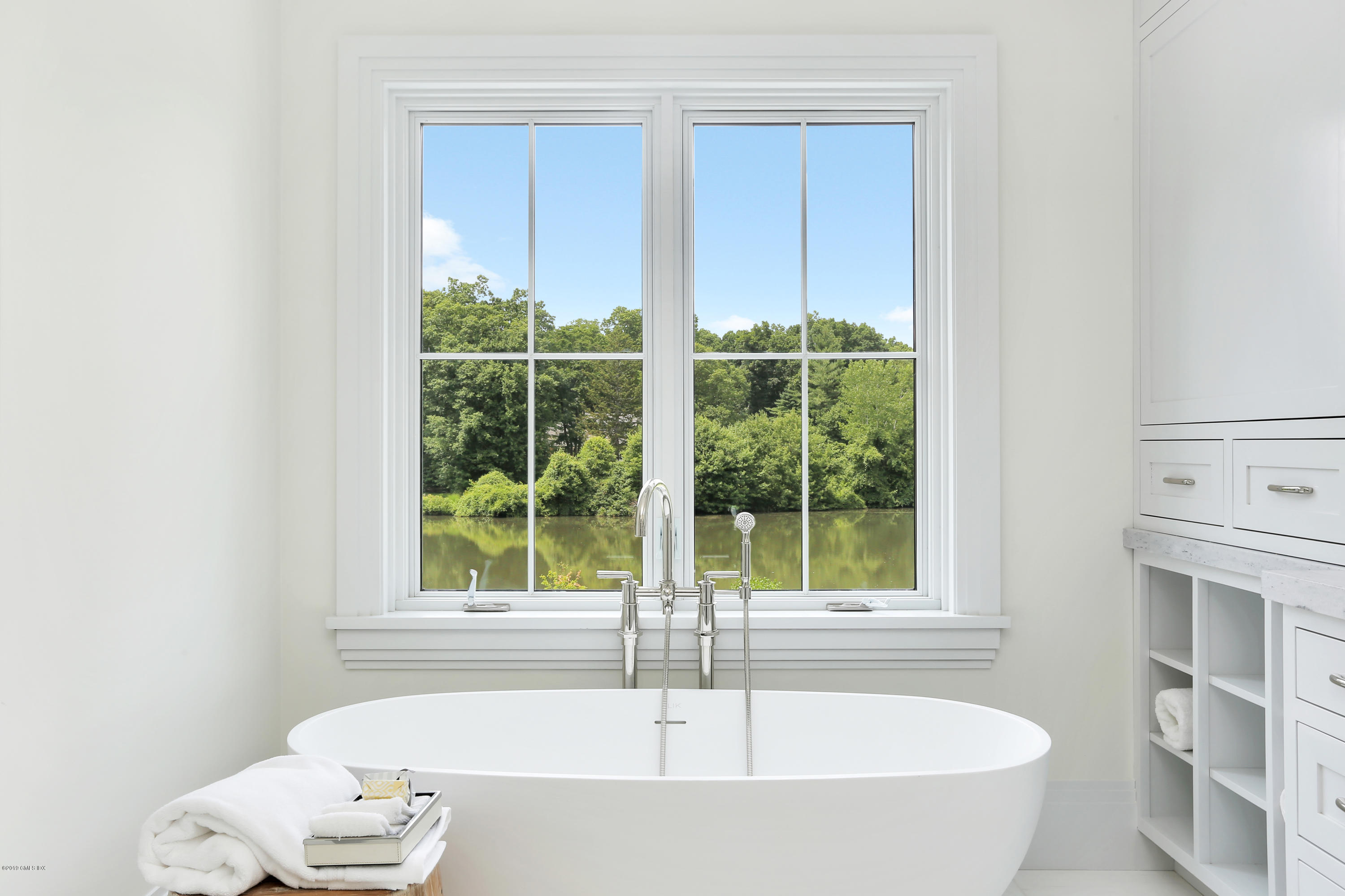38 Birch Lane Greenwich, CT 06830 - Photo 20 of 31 a bathroom with bathtub and window