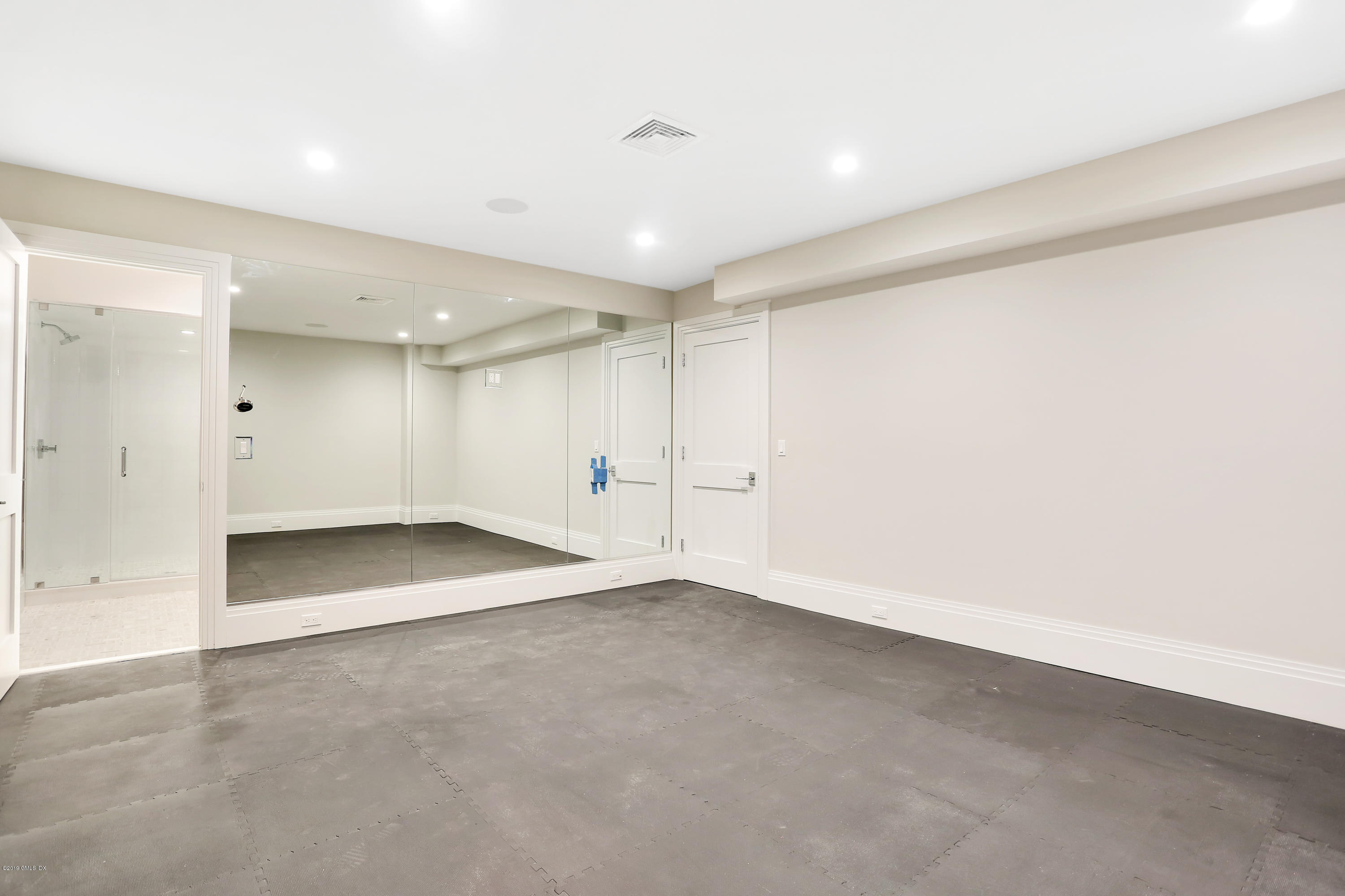 38 Birch Lane Greenwich, CT 06830 - Photo 22 of 31 an empty room with a empty space and windows
