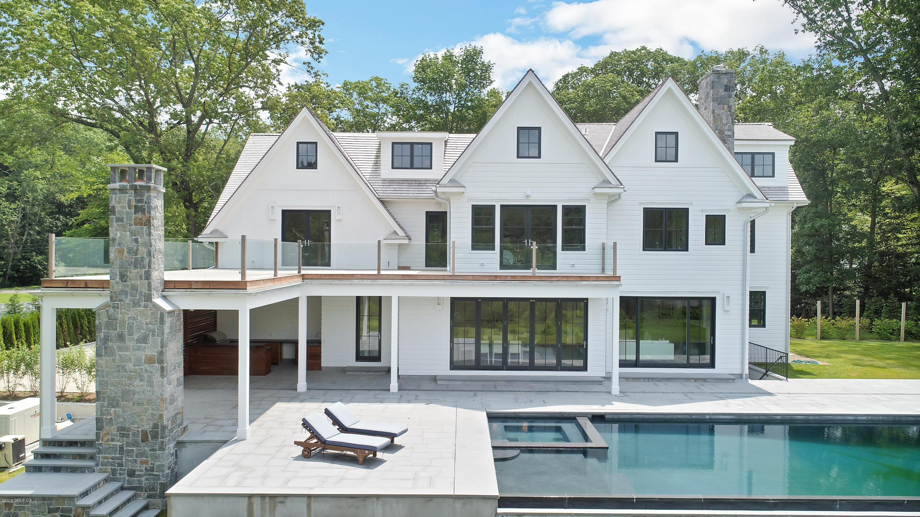 38 Birch Lane Greenwich, CT 06830 - Photo 23 of 31 a front view of a house with garden