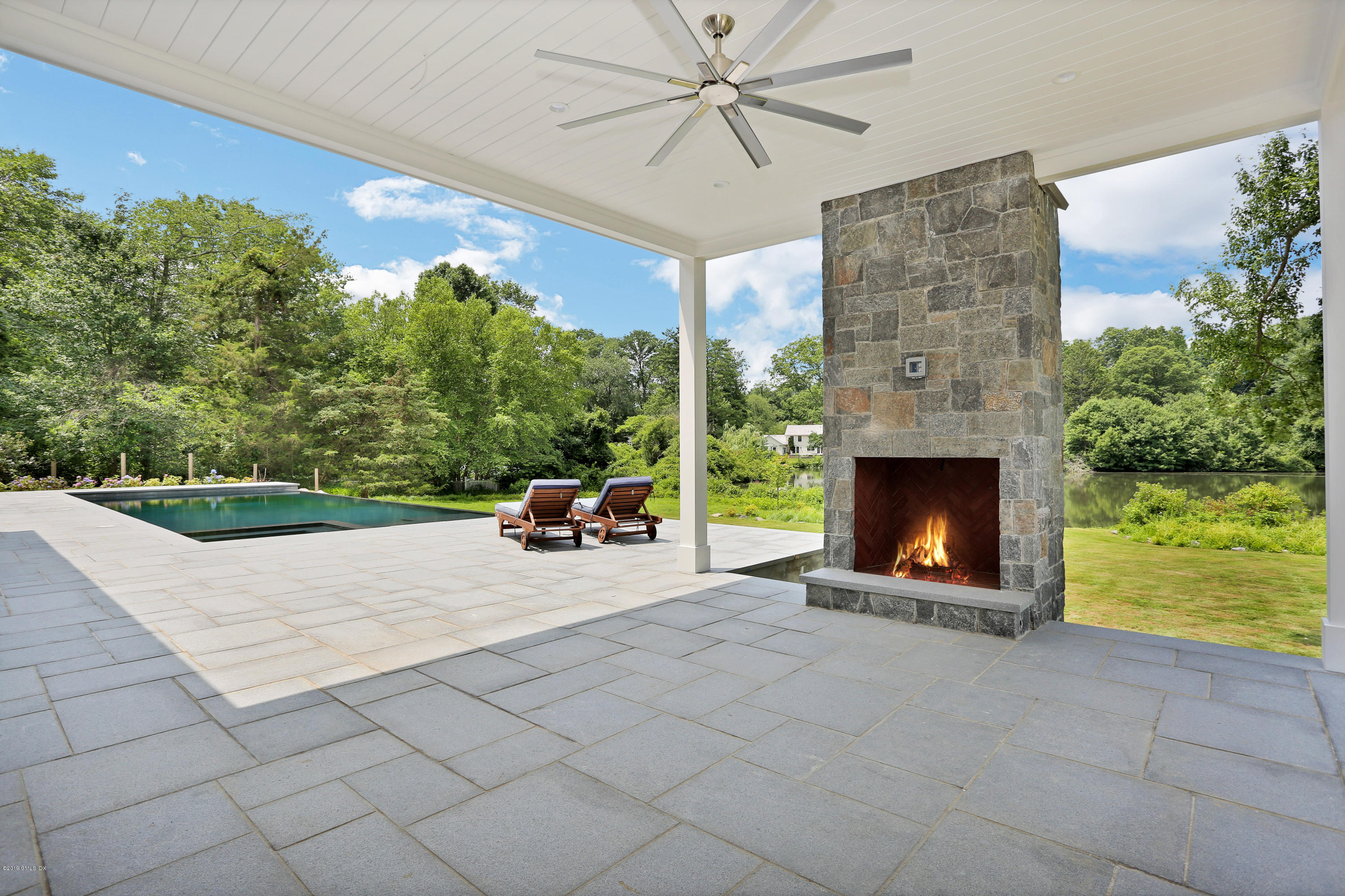 38 Birch Lane Greenwich, CT 06830 - Photo 24 of 31 a living room with furniture and a fireplace