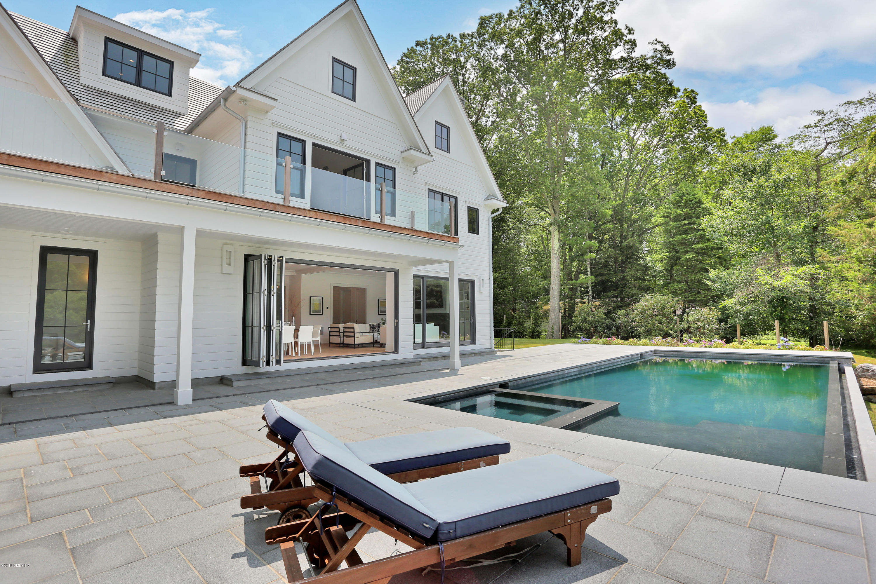38 Birch Lane Greenwich, CT 06830 - Photo 26 of 31 front view of a house with a yard
