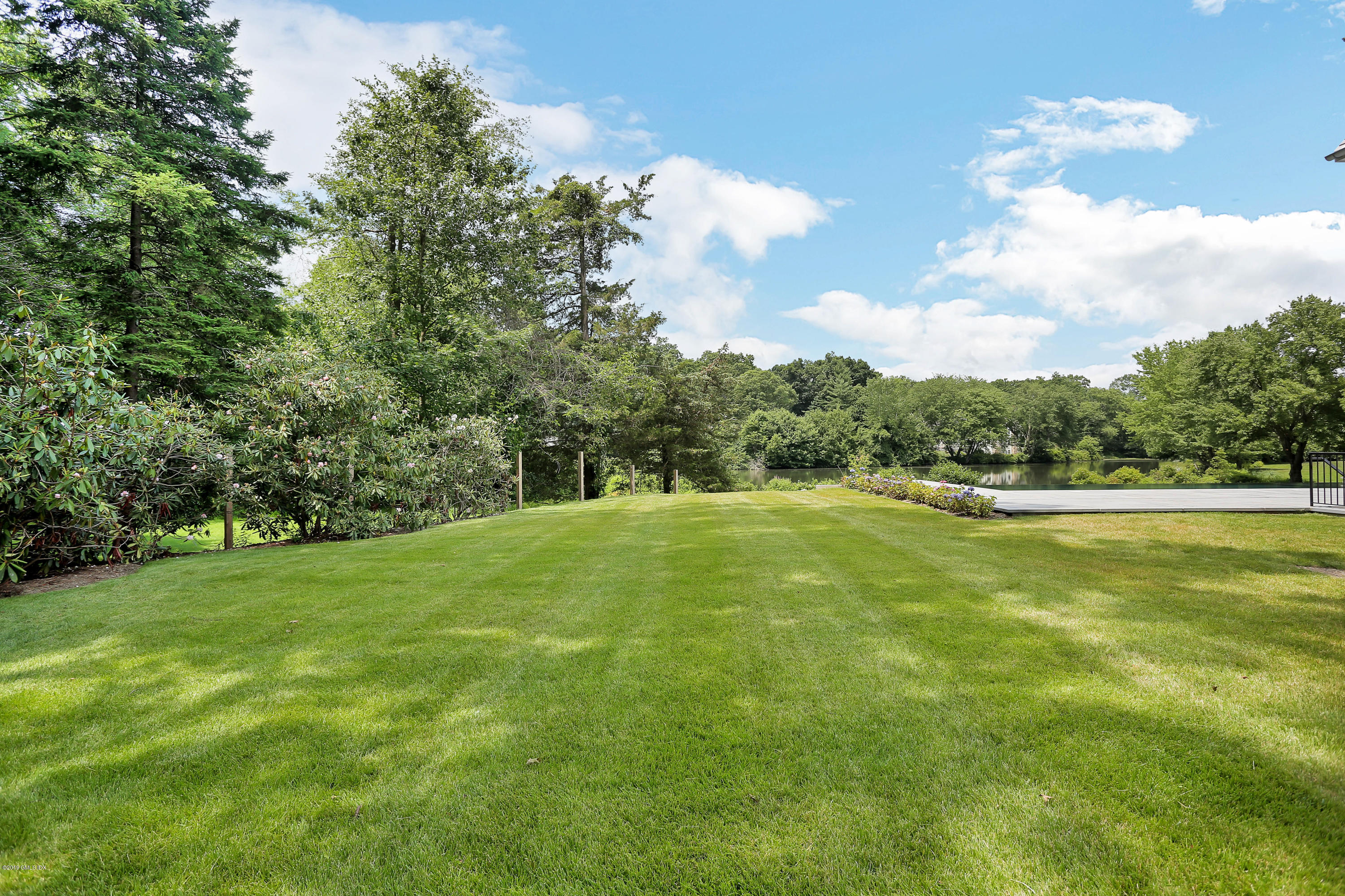 38 Birch Lane Greenwich, CT 06830 - Photo 27 of 31 a view of a big yard with large trees