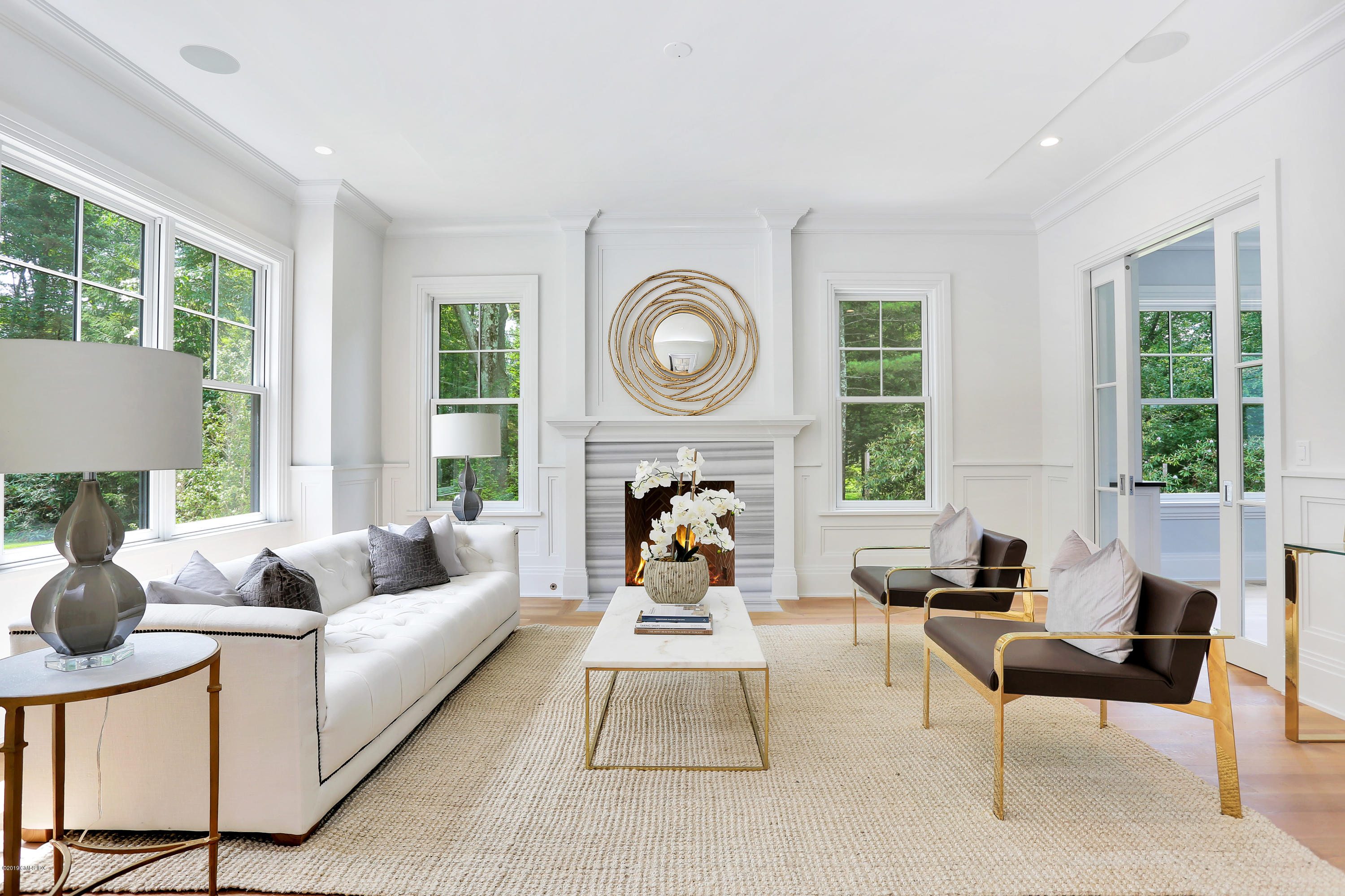 38 Birch Lane Greenwich, CT 06830 - Photo 4 of 31 a living room with furniture two window and a fireplace
