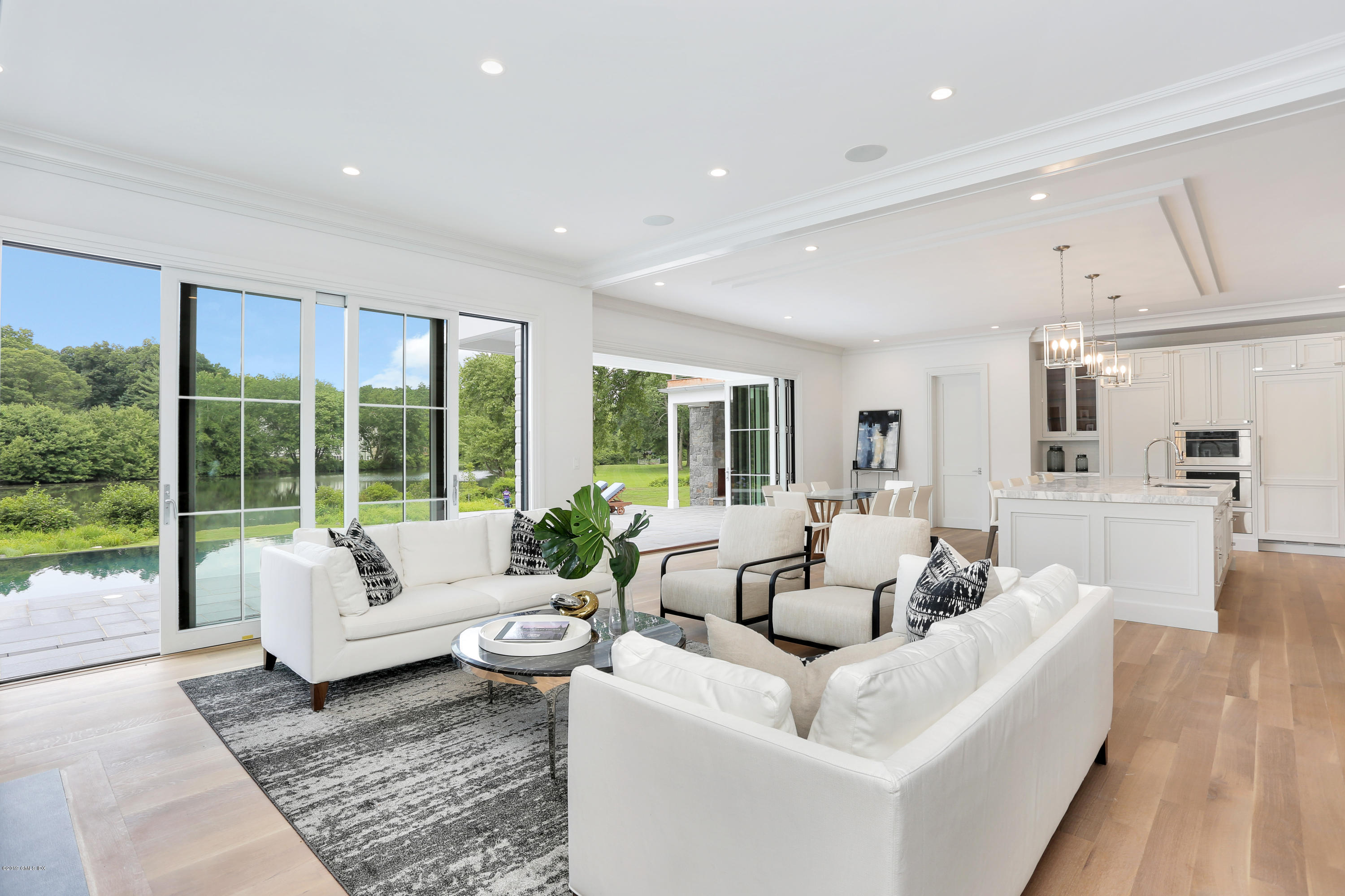 38 Birch Lane Greenwich, CT 06830 - Photo 6 of 31 a living room with furniture and a large window