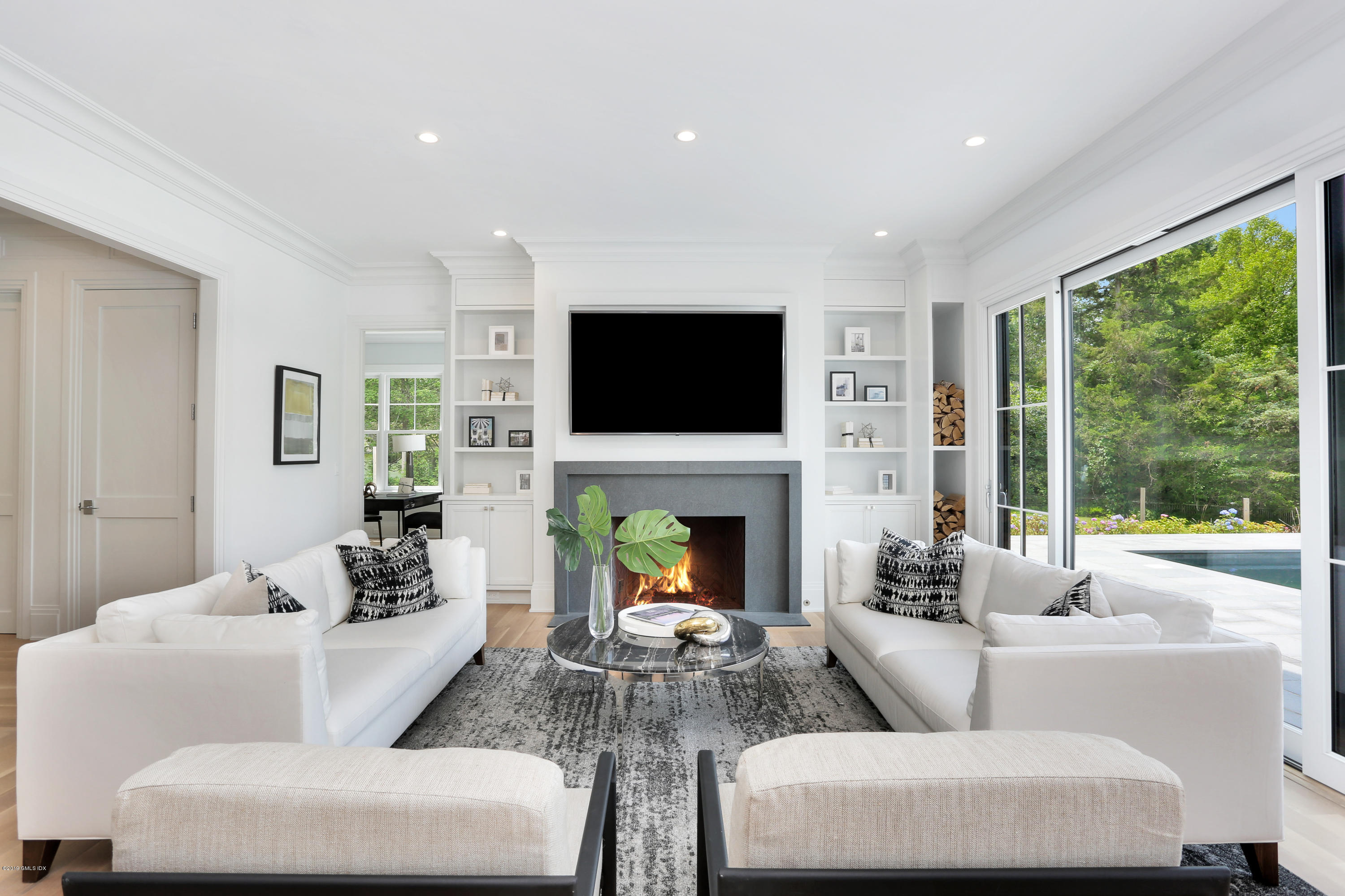 38 Birch Lane Greenwich, CT 06830 - Photo 8 of 31 a living room with fireplace furniture and a flat screen tv