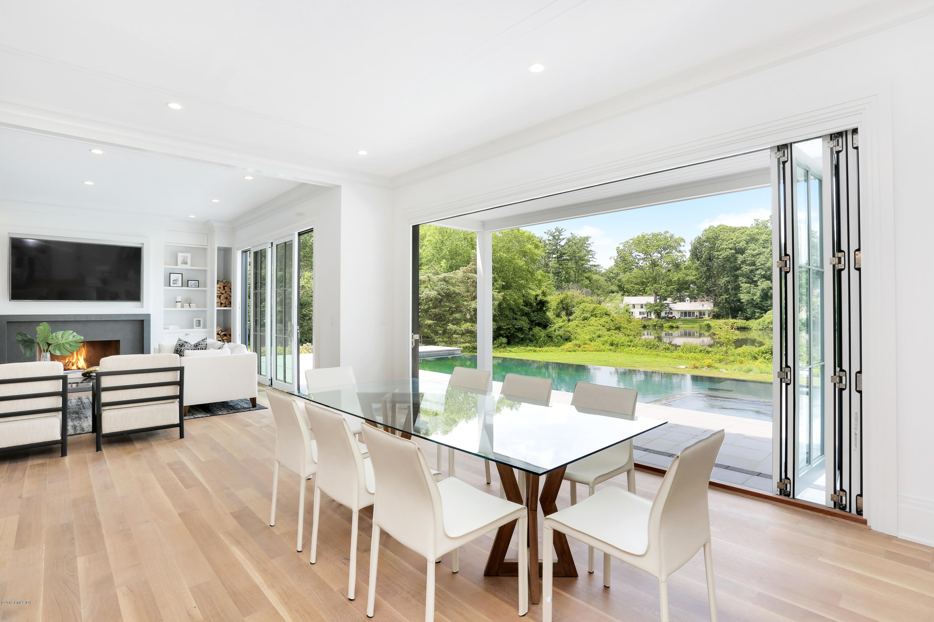 38 Birch Lane Greenwich, CT 06830 - Photo 9 of 31 a view of a dining room with furniture window and wooden floor