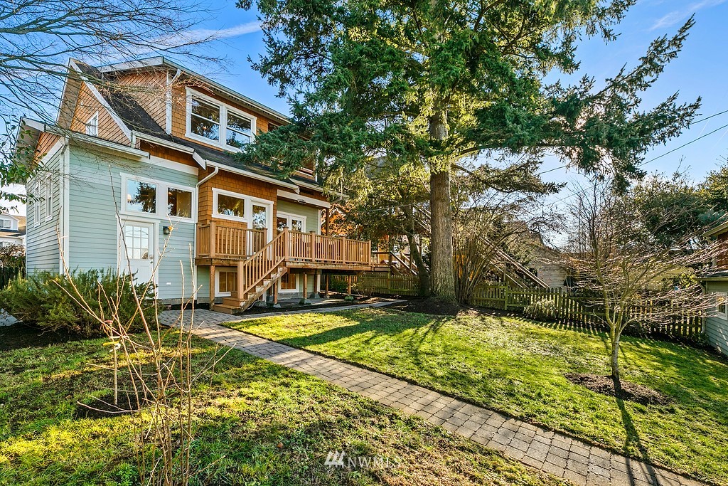 9547 Phinney Avenue North Seattle, WA 98103 - Photo 25 of 33 a view of a white house with a yard table and chairs