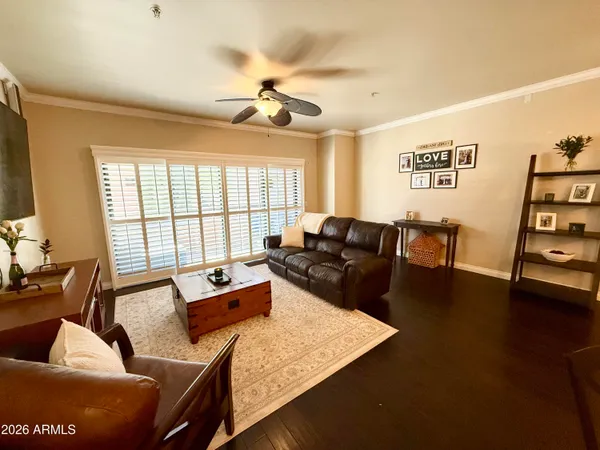 a living room with furniture and a large window