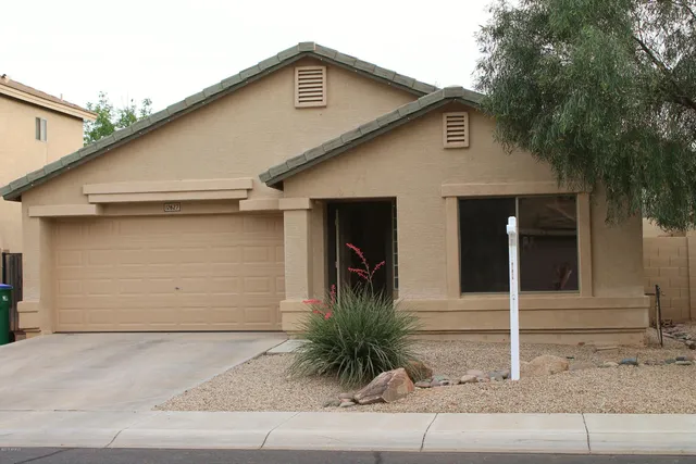 a front view of a house with garage