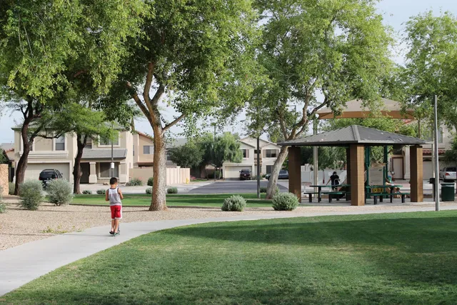 a front view of a house with a yard table and chairs