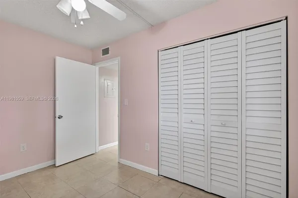 a room with closet and a window