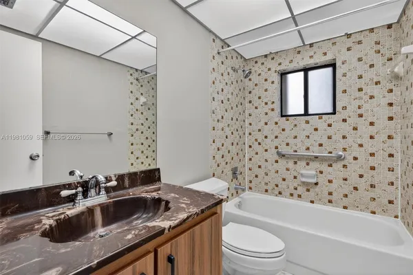 a view of an empty room with a fan