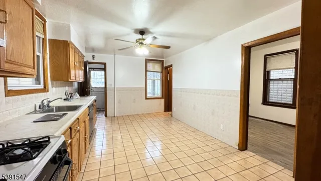 a view of a kitchen from a hallway