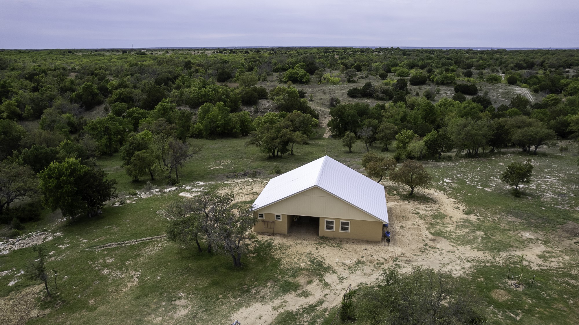 525 Jack Rabbit Circle Zephyr, TX 76890 - Photo 8 of 37 an aerial view of a house with a yard
