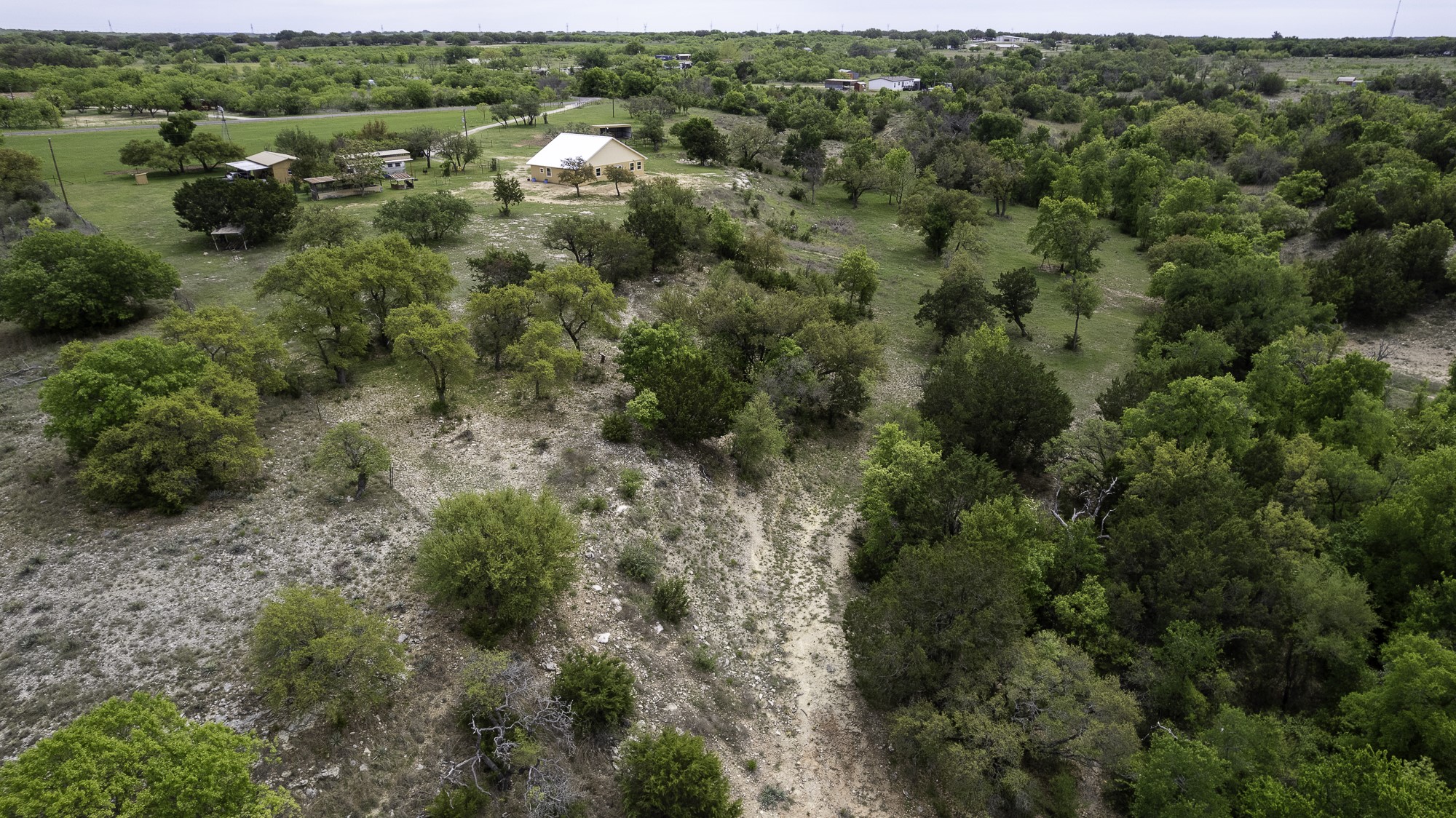 525 Jack Rabbit Circle Zephyr, TX 76890 - Photo 10 of 37 an aerial view of a houses with a yard