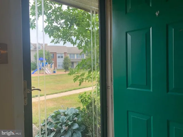 a front view of a building with play ground