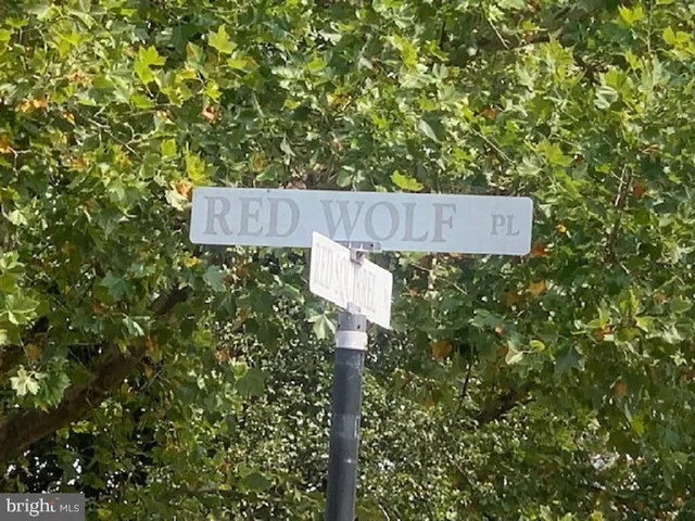 a view of a swimming pool with an outdoor space and seating area