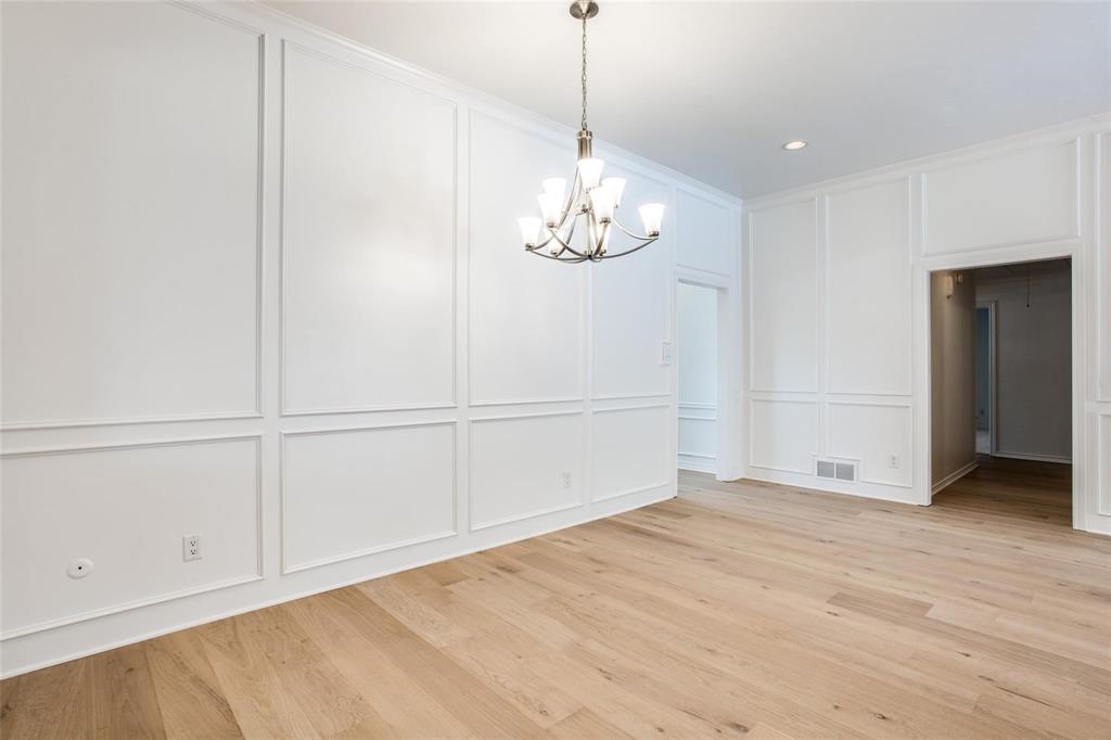 6926 Northwood Road Dallas, TX 75225 - Photo 10 of 29 a view of an empty room with wooden floor