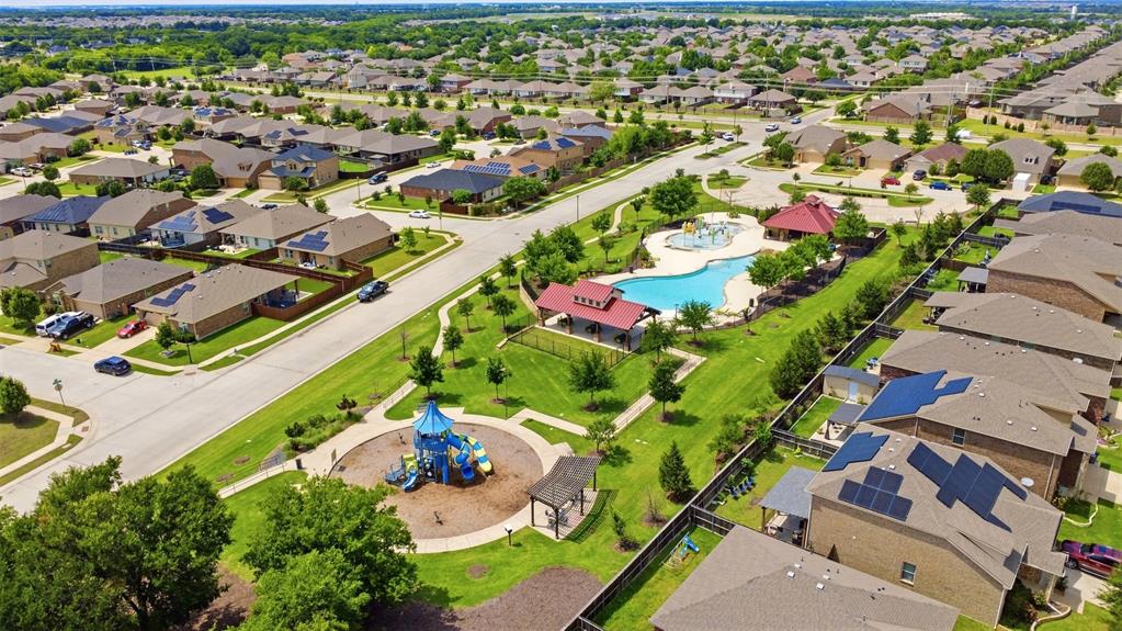 806 Silver Street Princeton, TX 75407 - Photo 4 of 29 Community pool and playground surrounded by residential properties