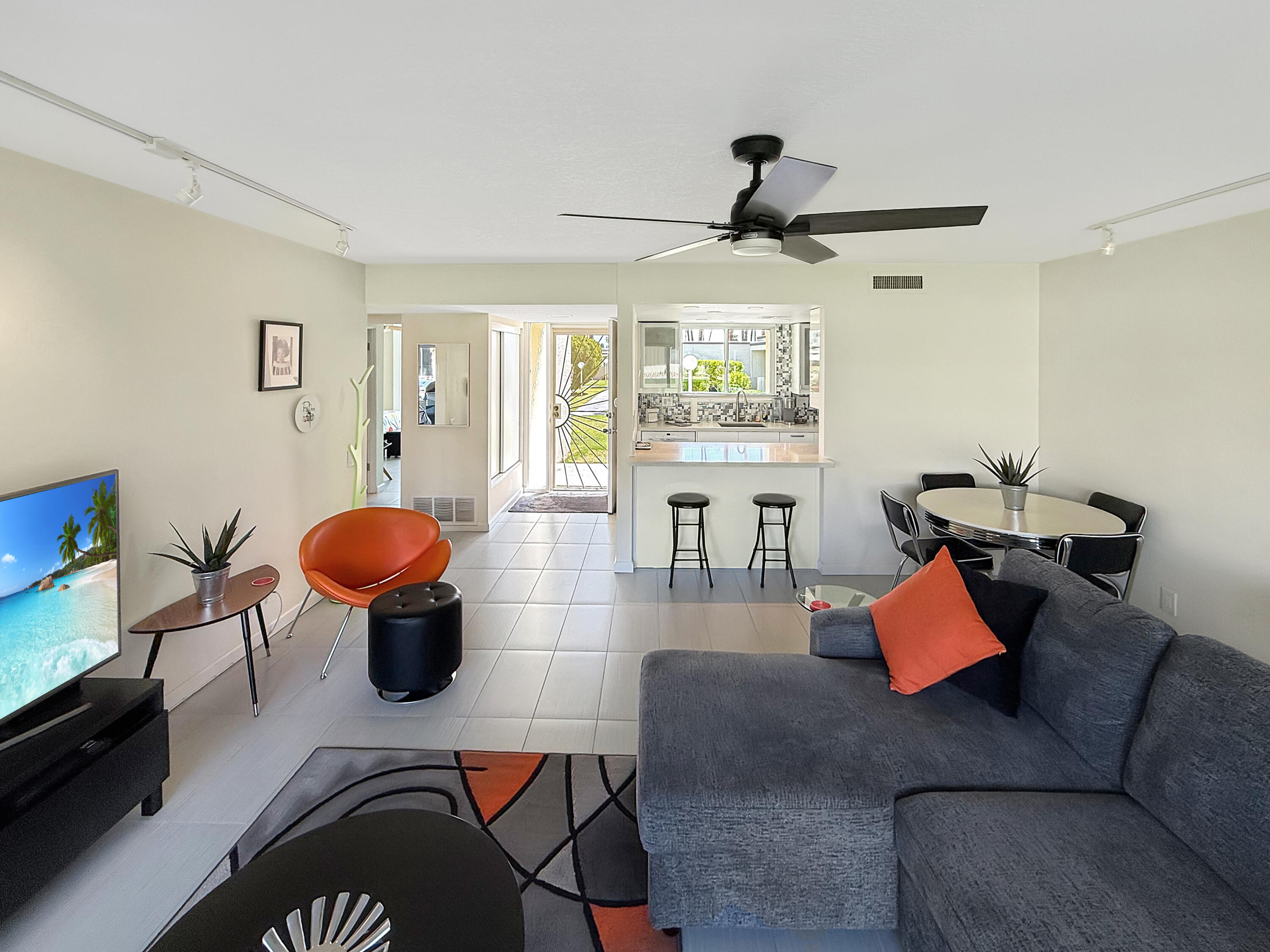 1881 South Araby Drive, Unit 16 Palm Springs, CA 92264 - Photo 11 of 52 a living room with furniture and a large window