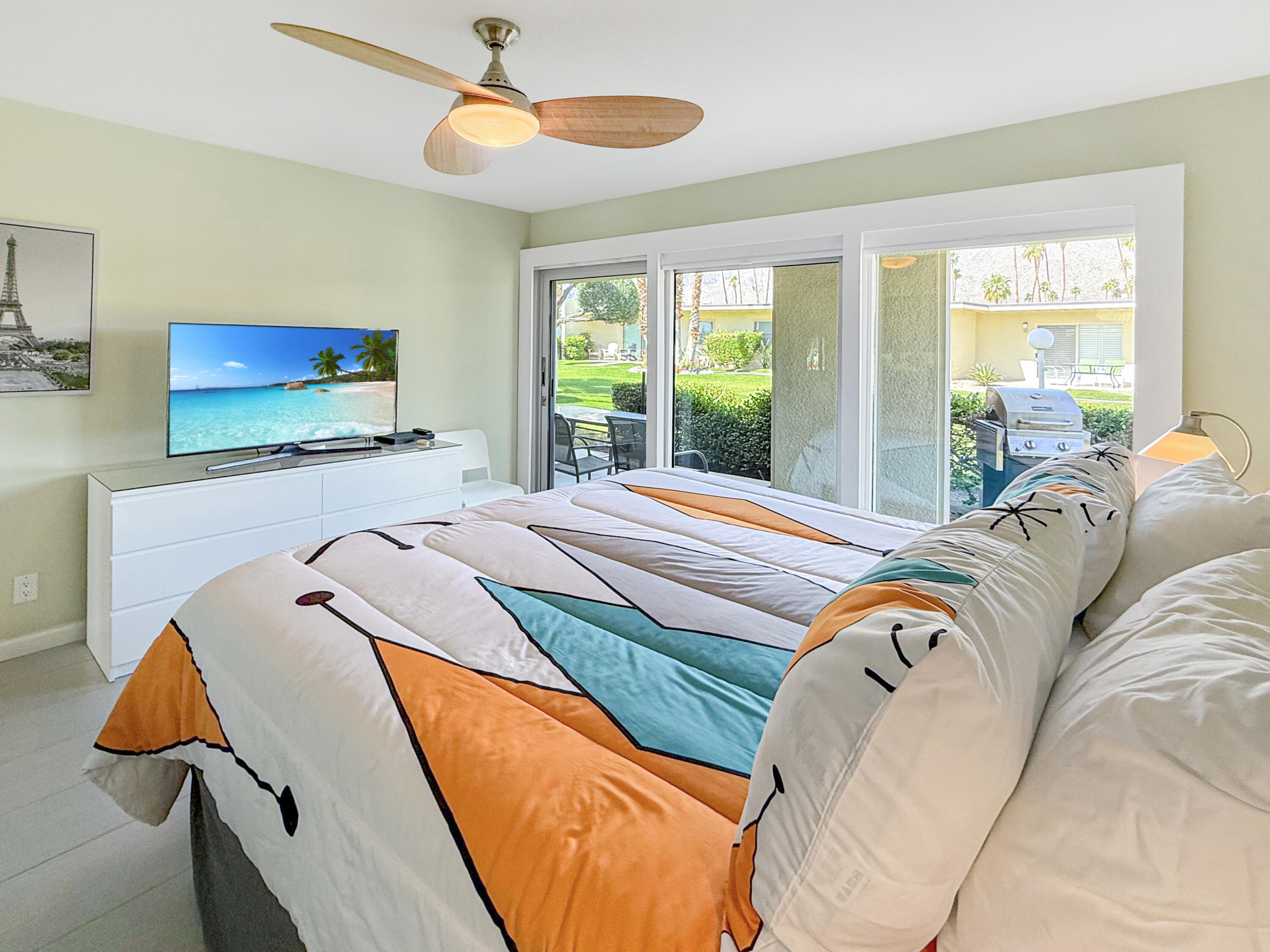 1881 South Araby Drive, Unit 16 Palm Springs, CA 92264 - Photo 19 of 52 a bed sitting in a bedroom next to a window