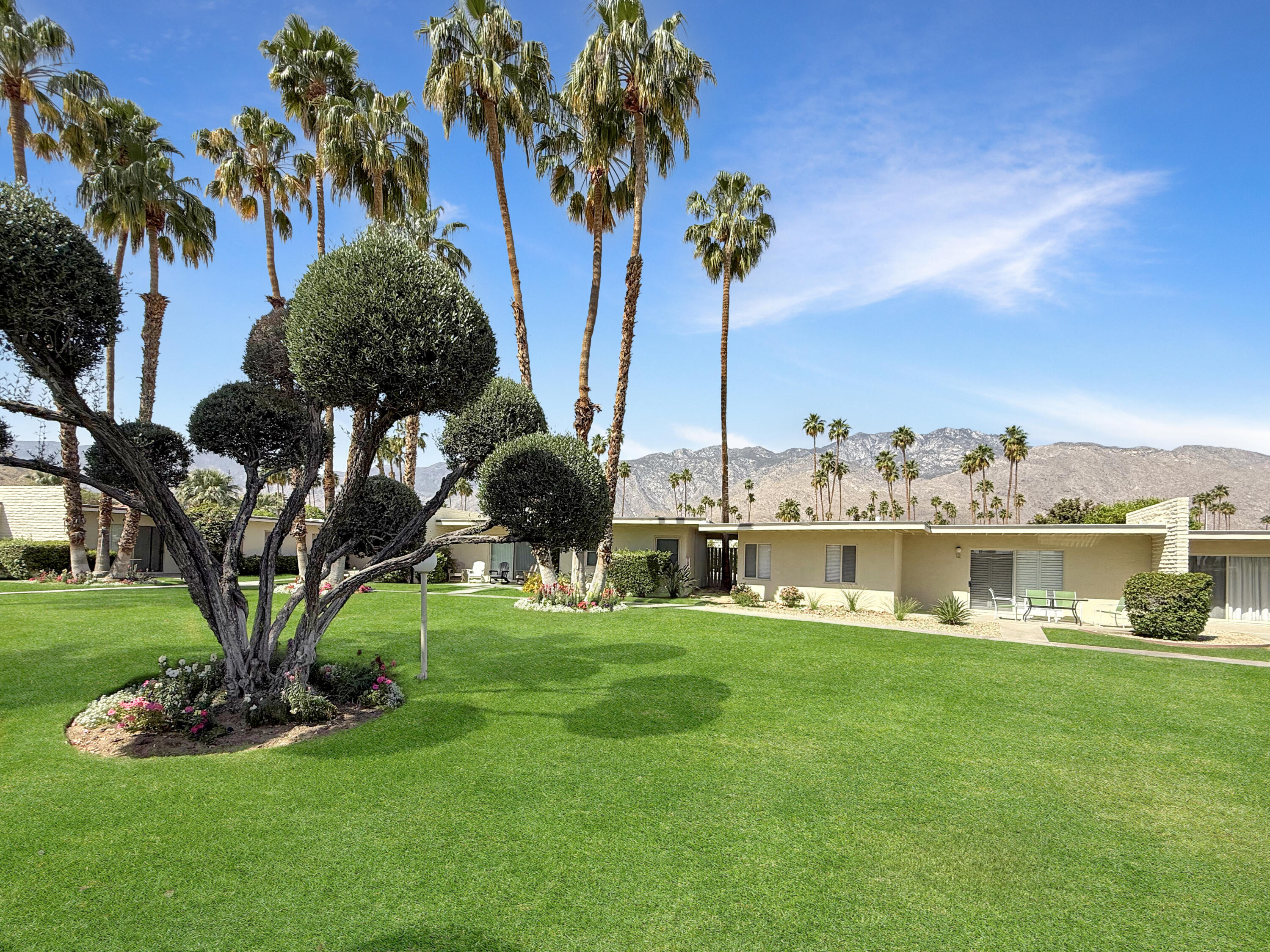1881 South Araby Drive, Unit 16 Palm Springs, CA 92264 - Photo 34 of 52 a view of a lake with a big yard