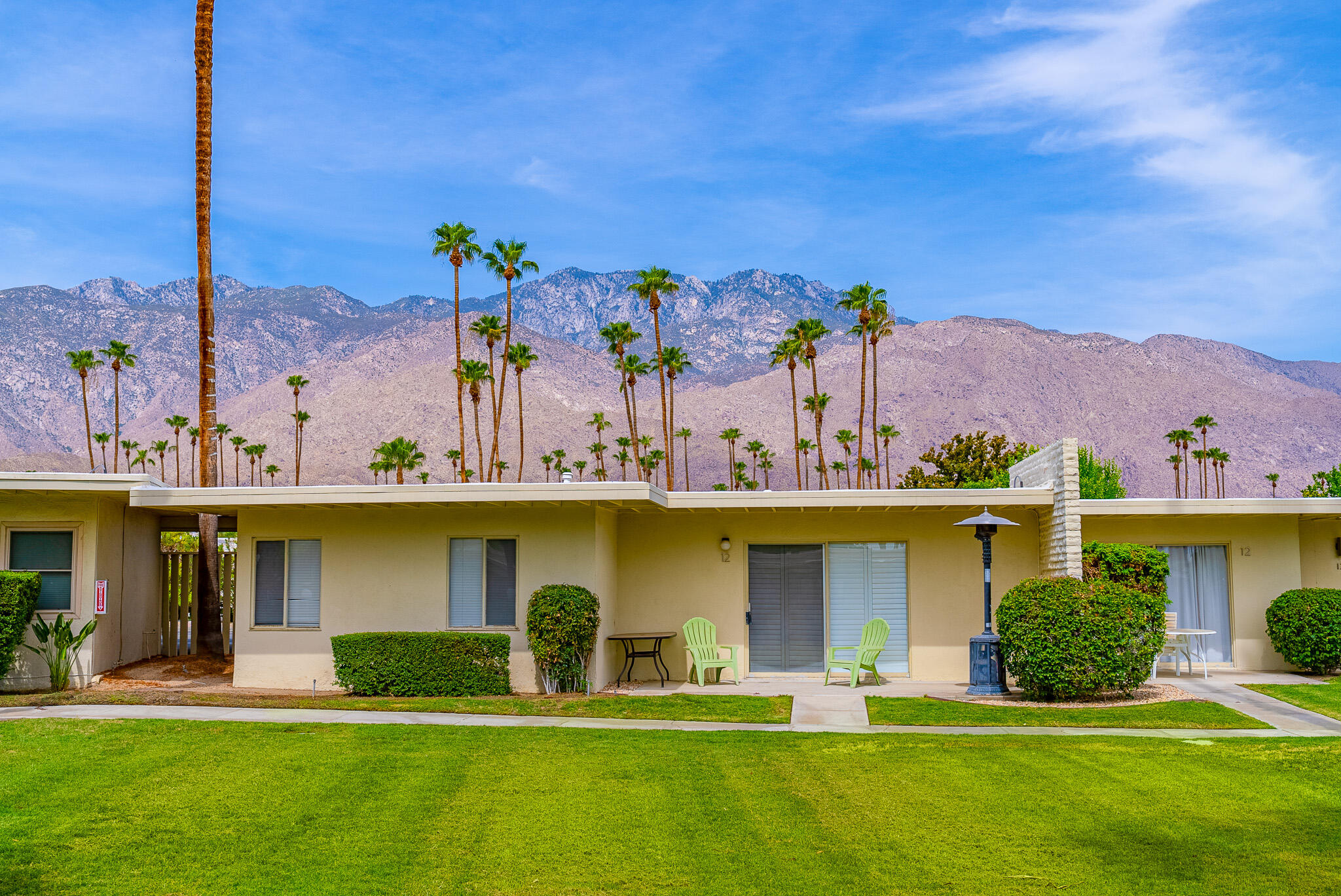 1881 South Araby Drive, Unit 16 Palm Springs, CA 92264 - Photo 37 of 52 a view of a swimming pool with a yard