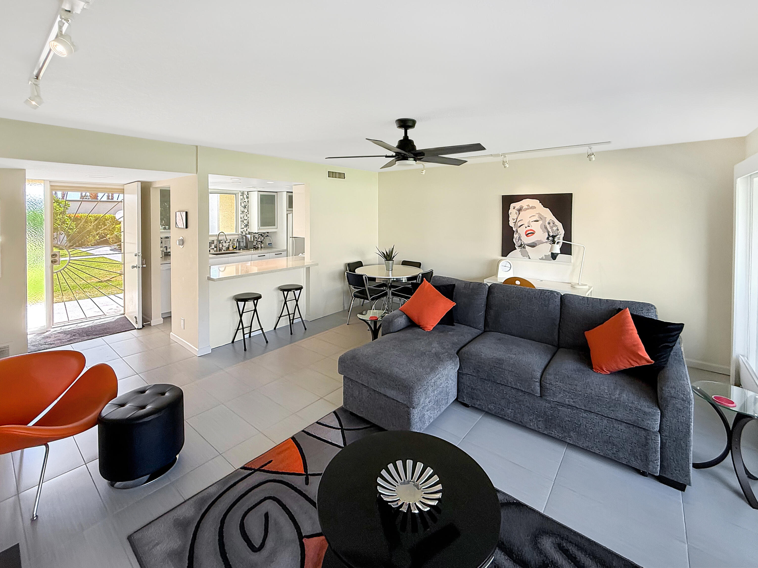 1881 South Araby Drive, Unit 16 Palm Springs, CA 92264 - Photo 10 of 52 a living room with furniture and a large window