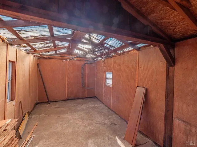 a view of a room with glass windows and stairs