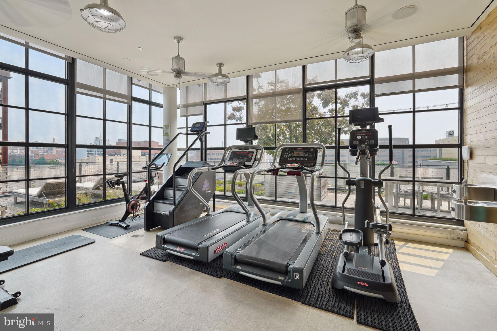 2030 8th Street Northwest, Unit PH5 Washington, DC 20001 - Photo 16 of 18 Bright fitness space with city views.