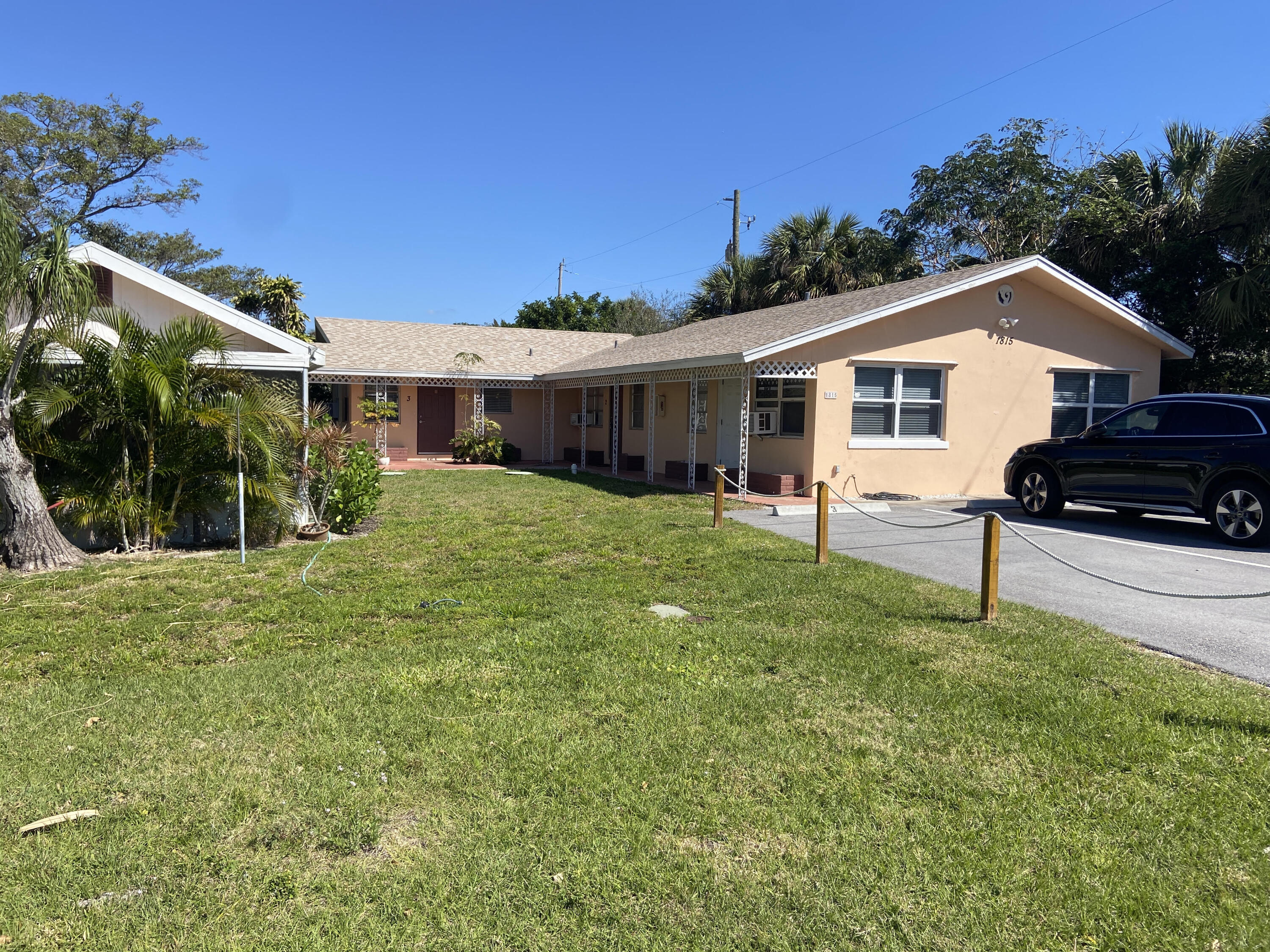1815 Juno Road, Unit 3 North Palm Beach, FL 33408 - Photo 1 of 15 a view of a house with a yard