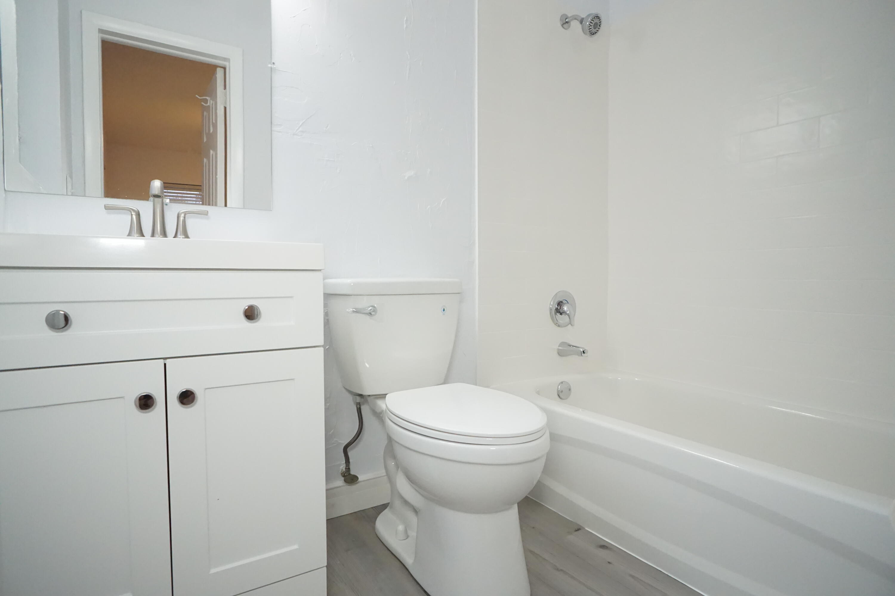 1815 Juno Road, Unit 3 North Palm Beach, FL 33408 - Photo 12 of 15 a bathroom with a sink and a mirror