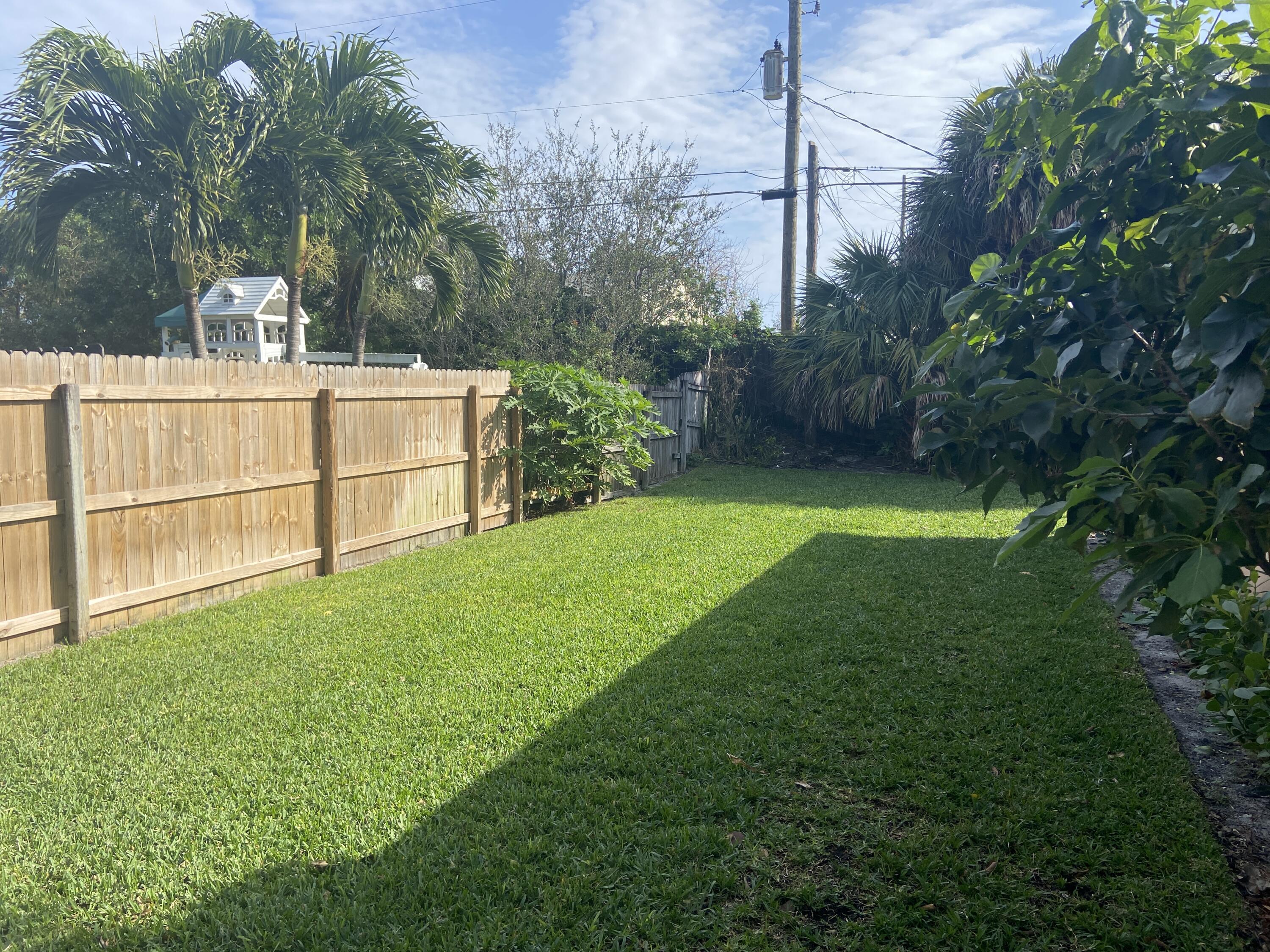 1815 Juno Road, Unit 3 North Palm Beach, FL 33408 - Photo 15 of 15 a view of a backyard