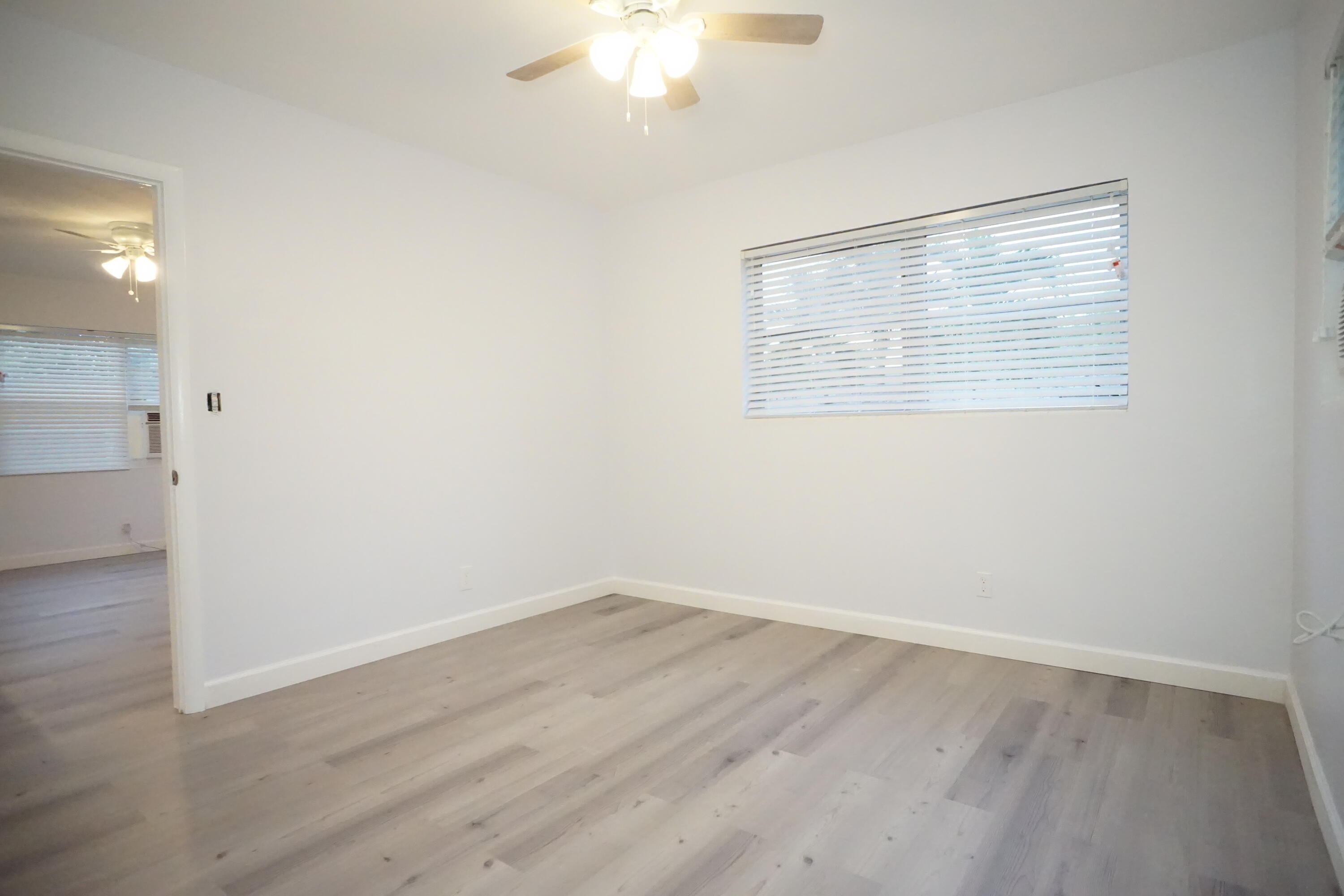 1815 Juno Road, Unit 3 North Palm Beach, FL 33408 - Photo 10 of 15 wooden floor in an empty room