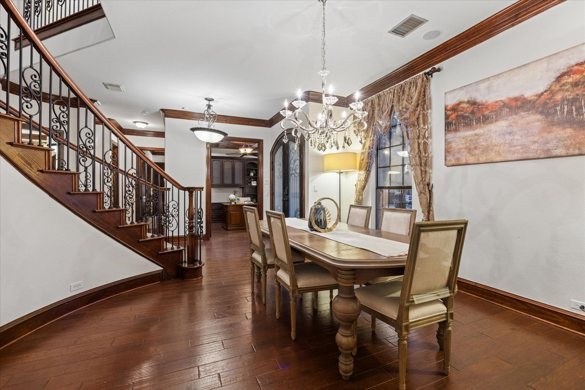 11805 Ranchview Court Austin, TX 78732 - Photo 10 of 36 Formal dining space featuring wood-finish flooring and a crystal chandelier