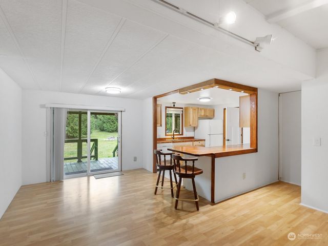 a workspace room with furniture and window