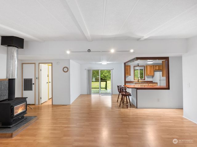 a view of livingroom with furniture window and wooden floor