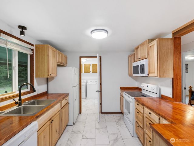 a bathroom with a sink double vanity and a tub