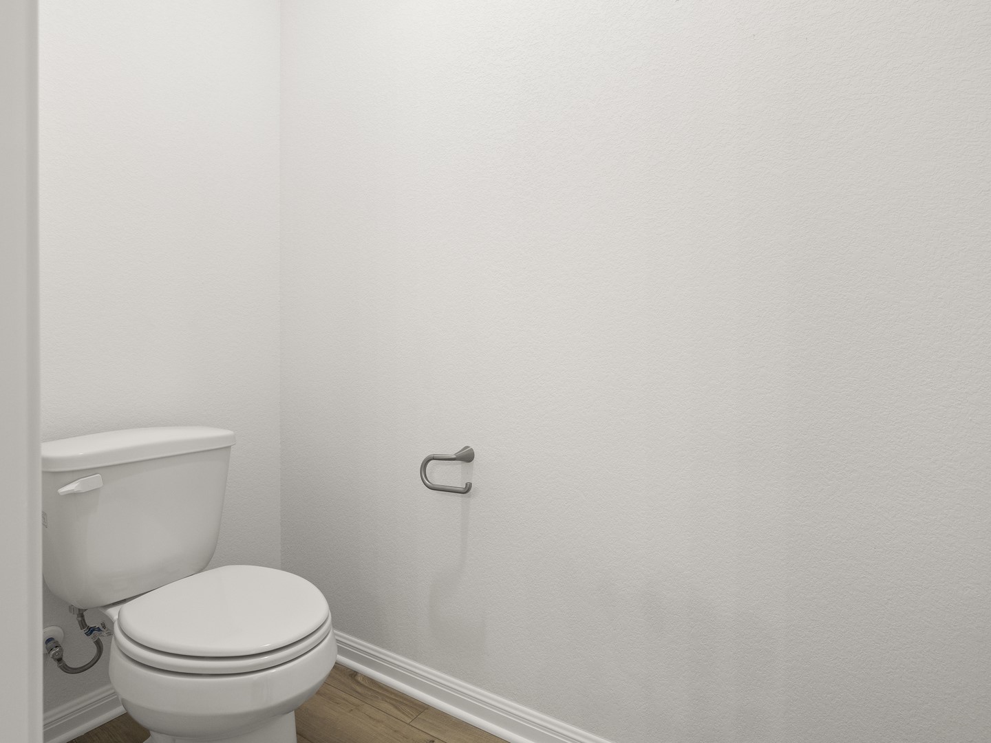 112 Mathew Street Bertram, TX 78605 - Photo 22 of 32 A well-maintained commode offers convenience in this neat powder room.