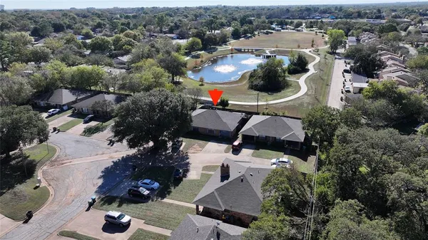 an aerial view of houses with yard