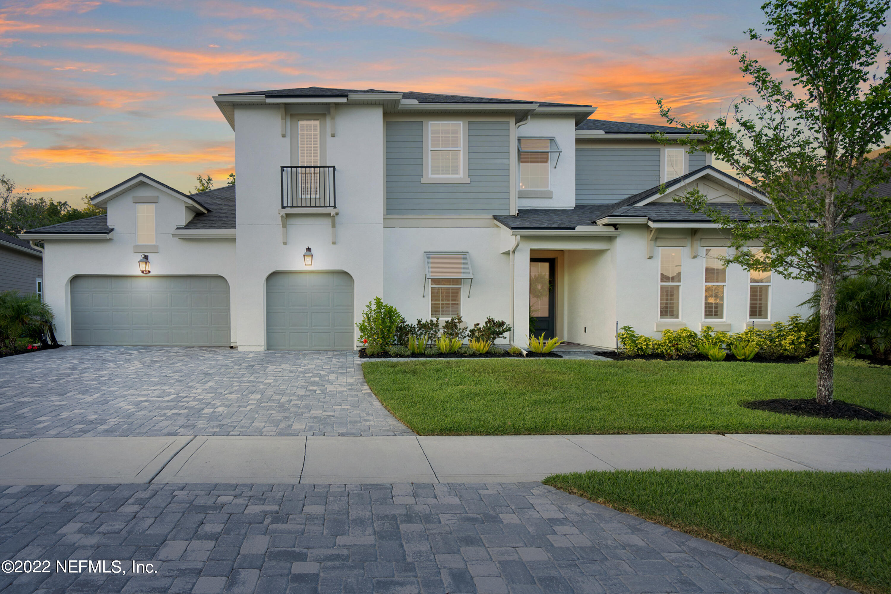 126 Broadleaf Lane St. Johns, FL 32259 - Photo 1 of 70 a front view of a house with a yard and garage
