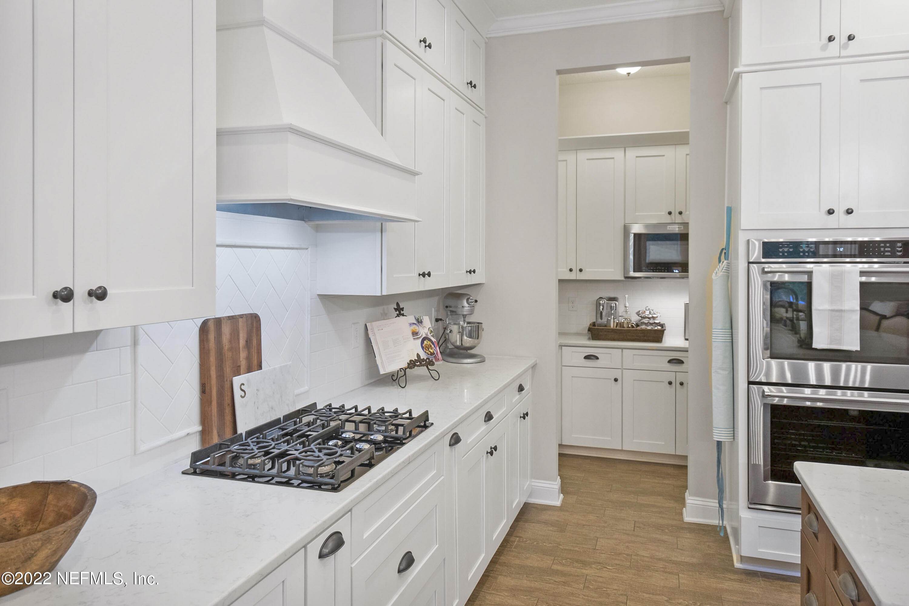 126 Broadleaf Lane St. Johns, FL 32259 - Photo 16 of 70 a kitchen with white cabinets and appliances