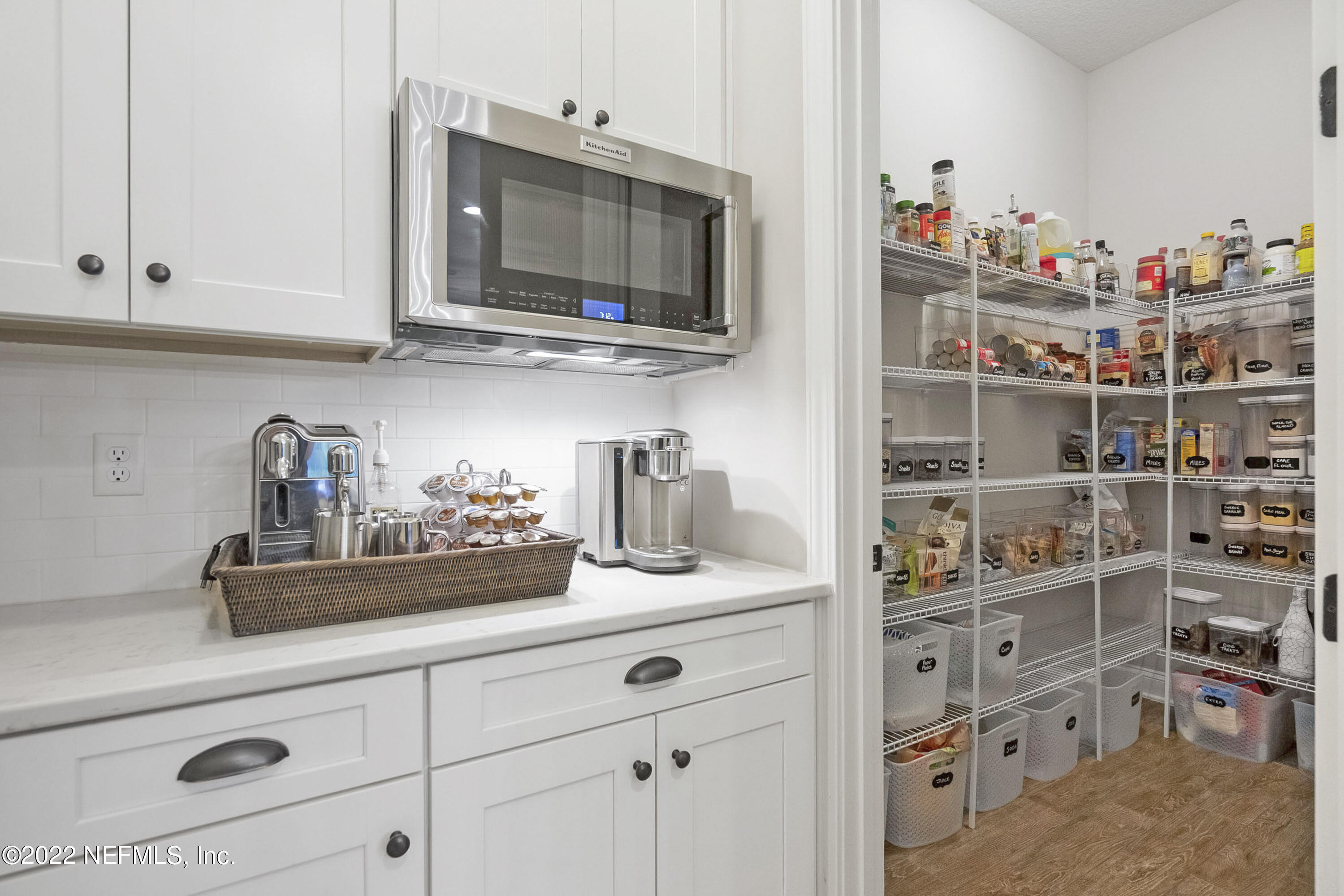 126 Broadleaf Lane St. Johns, FL 32259 - Photo 17 of 70 a kitchen with a microwave and cabinets