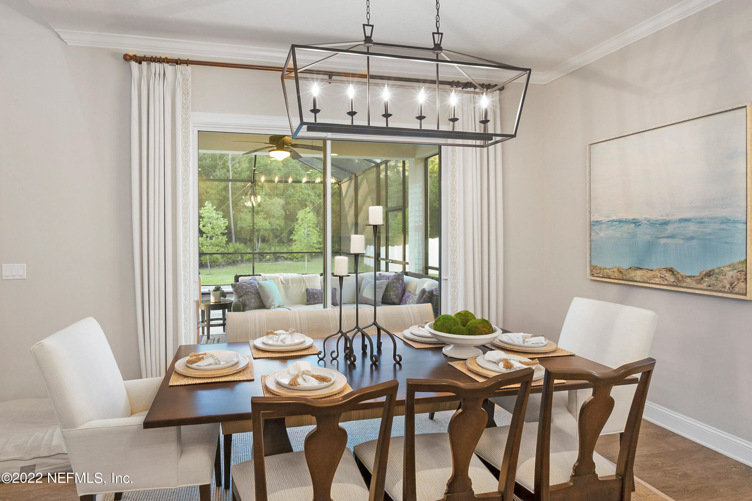 126 Broadleaf Lane St. Johns, FL 32259 - Photo 21 of 70 a dining room with furniture a chandelier and wooden floor