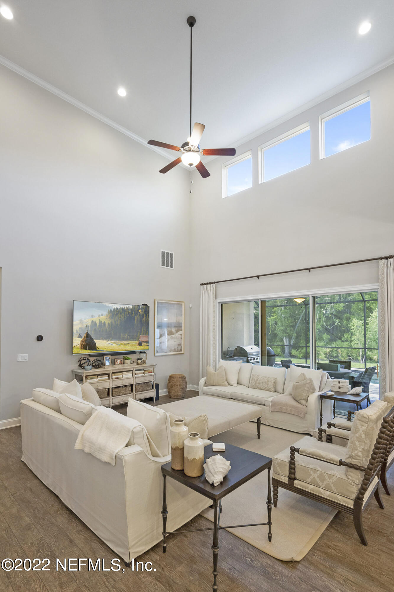 126 Broadleaf Lane St. Johns, FL 32259 - Photo 25 of 70 a living room with furniture fireplace and a large window